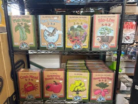 Down To Earth all-natural boxed fertilizers on a rack