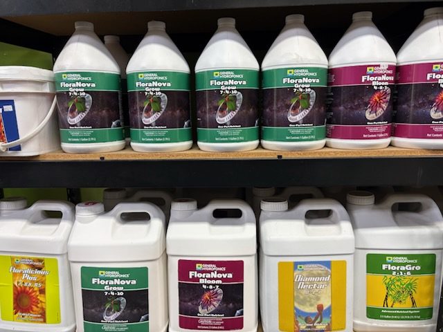 General Hydroponics FloraNova Grow and Bloom bottles on the nutrient shelf