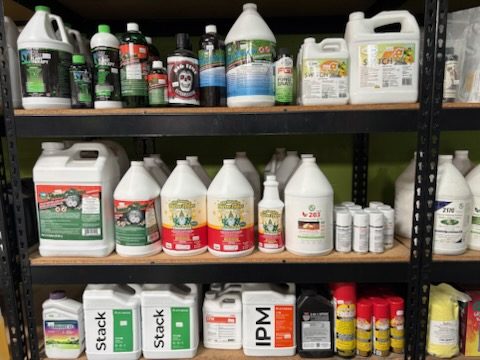 Shelves of pest and disease control products including IPM concentrates