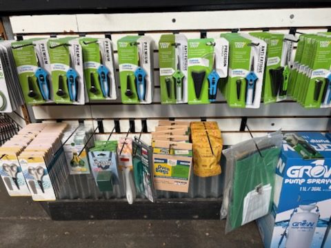 Wall display of pruners, trimming snips, and precision shears
